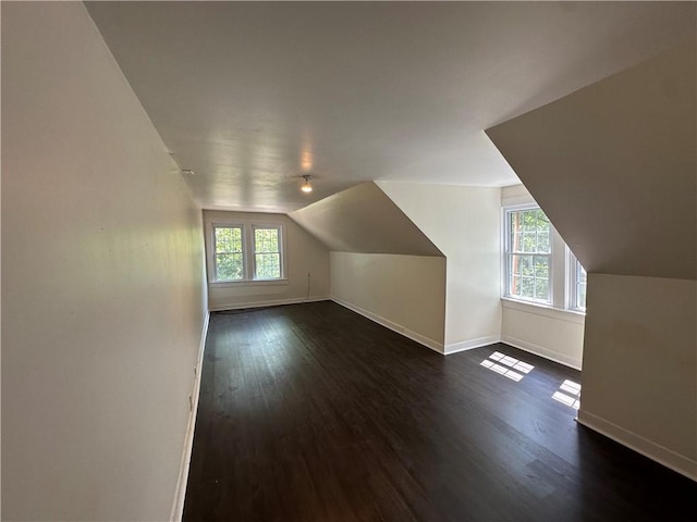 301 W Bean St, Lincoln, AR 72744 - bonus room featuring baseboards, vaulted ceiling, and dark wood-style floors