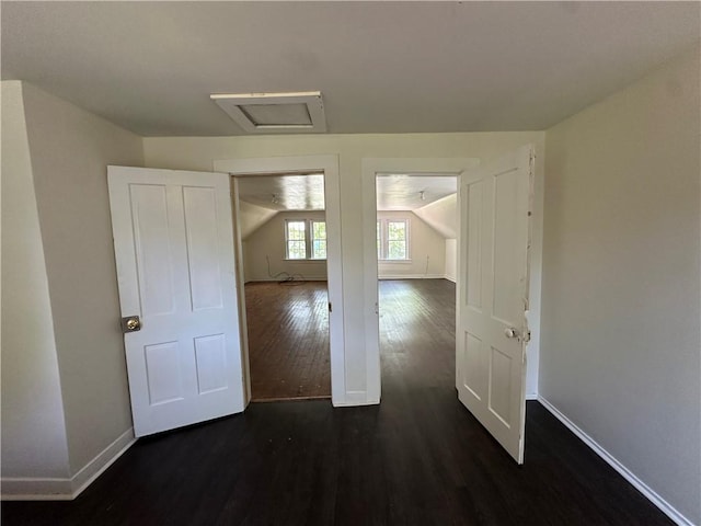 301 W Bean St, Lincoln, AR 72744 - unfurnished room featuring dark wood-style floors, baseboards, and attic access