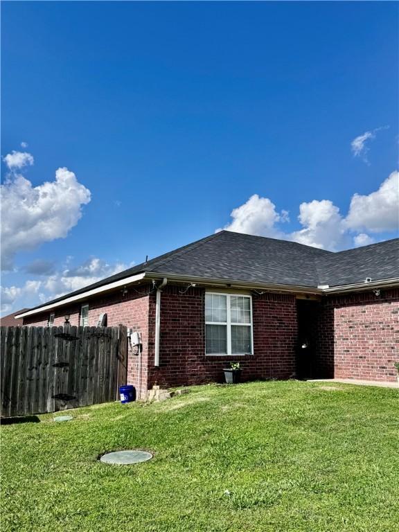 1297 Homestead Loop, Springdale, AR 72764 - view of home's exterior featuring brick siding and roof with shingles