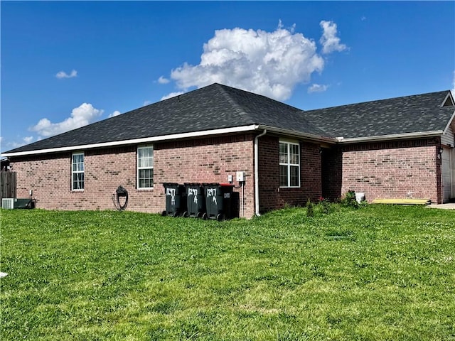1297 Homestead Loop, Springdale, AR 72764 - view of home's exterior featuring brick siding, a lawn, roof with shingles, and a garage