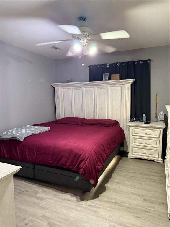 1269 E Homestead Loop, Springdale, AR 72764 - bedroom with light wood-style flooring and a ceiling fan