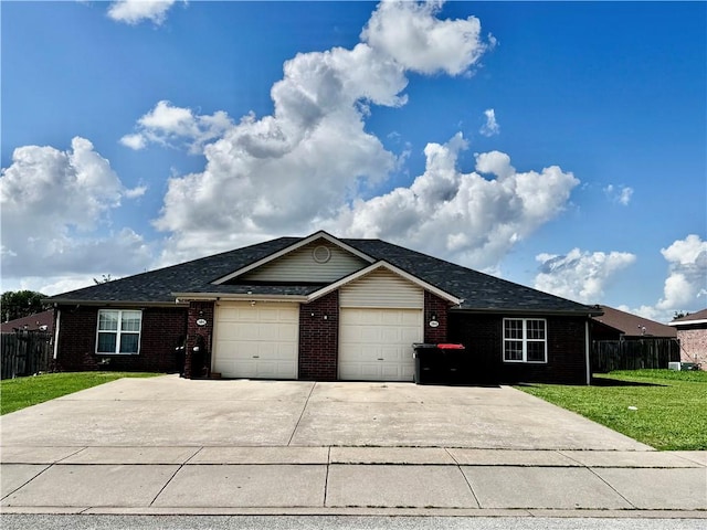 1269 E Homestead Loop, Springdale, AR 72764 - ranch-style home with brick siding, a garage, concrete driveway, and roof with shingles