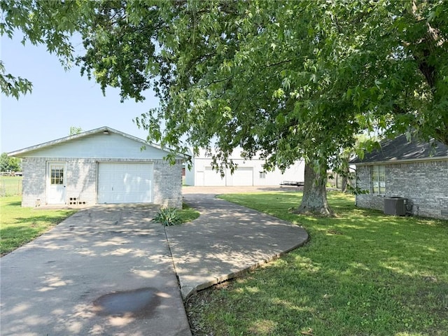 291 S Industrial Park Rd, Prairie Grove, AR 72753 - view of front of home with brick siding, driveway, cooling unit, and a front yard