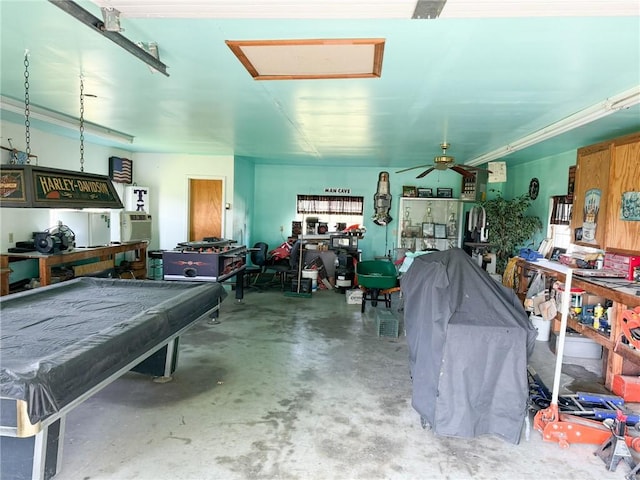 291 S Industrial Park Rd, Prairie Grove, AR 72753 - garage with a ceiling fan and a workshop area