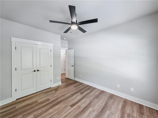 9 Sheidaig Ln, Bella Vista, AR 72715 - unfurnished bedroom with wood finished floors, a closet, and ceiling fan