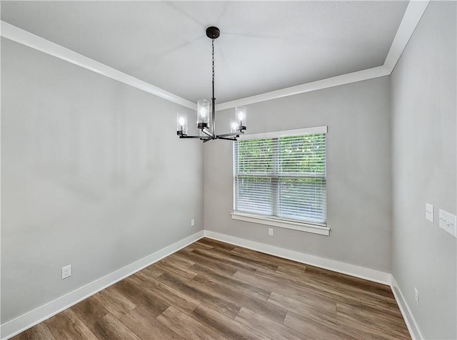 9 Sheidaig Ln, Bella Vista, AR 72715 - unfurnished room featuring a chandelier, crown molding, and dark wood-style flooring