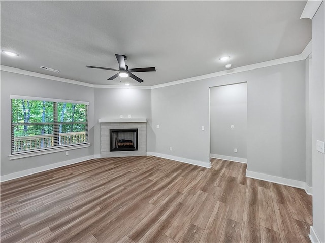 9 Sheidaig Ln, Bella Vista, AR 72715 - unfurnished living room with ceiling fan, wood finished floors, ornamental molding, recessed lighting, and a fireplace