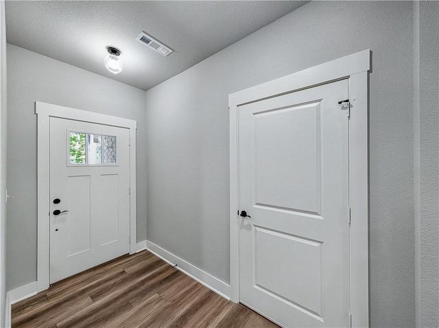 9 Sheidaig Ln, Bella Vista, AR 72715 - foyer entrance featuring dark wood-type flooring and baseboards