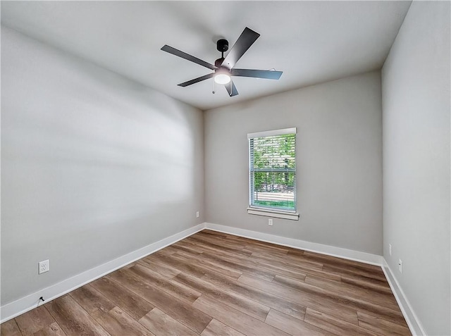 9 Sheidaig Ln, Bella Vista, AR 72715 - empty room featuring a ceiling fan and wood finished floors
