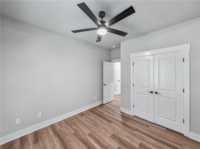 9 Sheidaig Ln, Bella Vista, AR 72715 - unfurnished bedroom featuring light wood-style flooring, a closet, and a ceiling fan