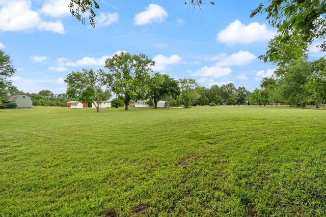 1900 76th Hwy, Anderson, MO 64831 - view of green lawn featuring a shed