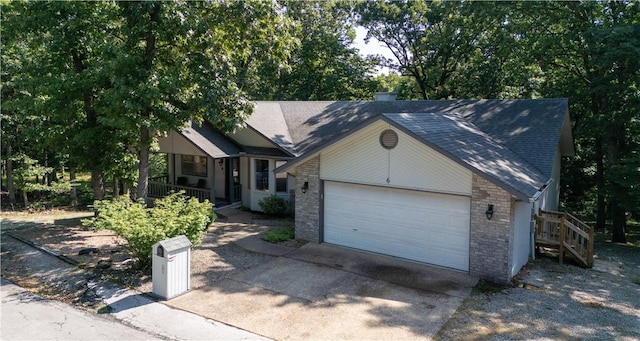 6 Muker Ln, Bella Vista, AR 72714 - single story home with driveway, a porch, brick siding, a shingled roof, and an attached garage
