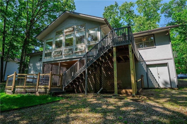 6 Muker Ln, Bella Vista, AR 72714 - rear view of property with stairway, a wooden deck, and a sunroom