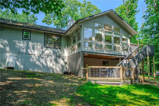6 Muker Ln, Bella Vista, AR 72714 - rear view of house featuring a sunroom