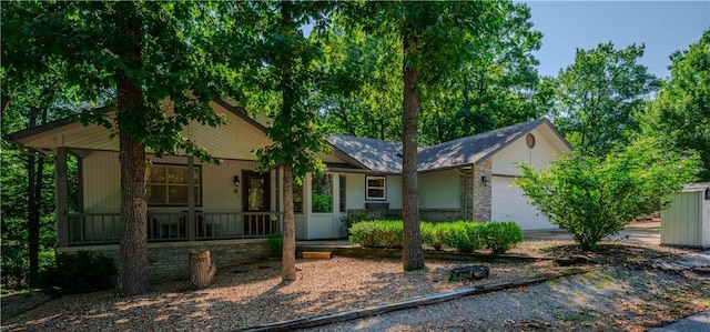 6 Muker Ln, Bella Vista, AR 72714 - view of front of home with covered porch and a garage