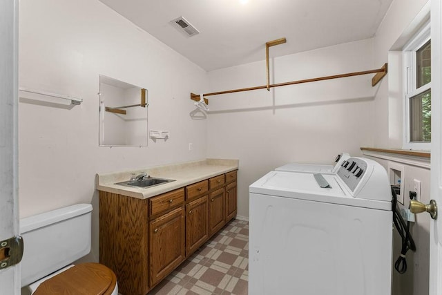 10 Magrath Ln, Bella Vista, AR 72715 - washroom with washer and dryer and light floors