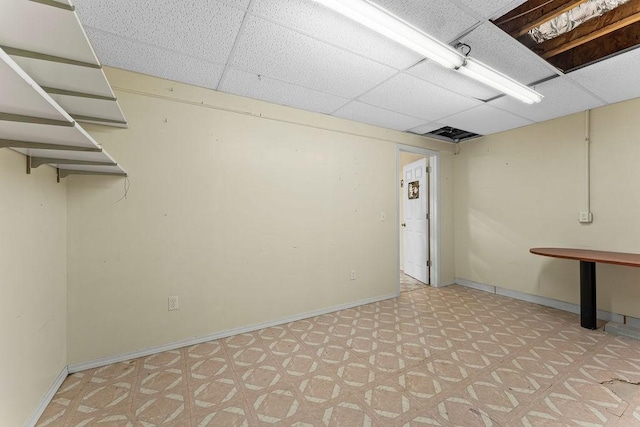 10 Magrath Ln, Bella Vista, AR 72715 - finished below grade area featuring a drop ceiling, baseboards, and light floors