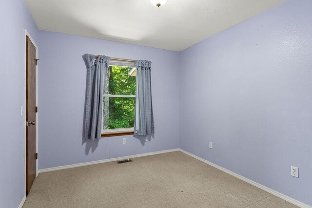 10 Magrath Ln, Bella Vista, AR 72715 - carpeted spare room with baseboards
