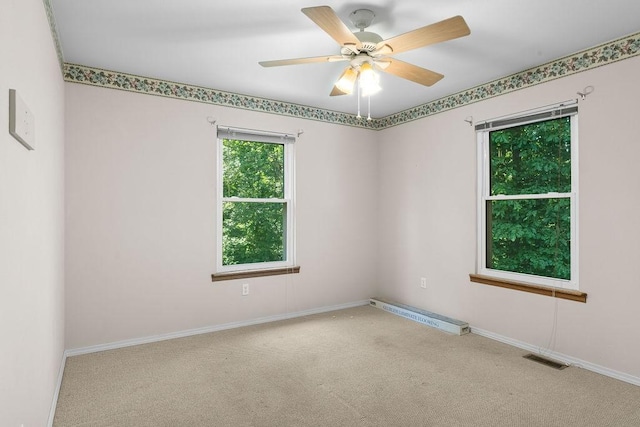 10 Magrath Ln, Bella Vista, AR 72715 - carpeted spare room featuring baseboards and ceiling fan