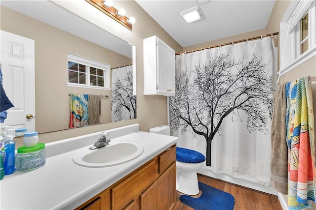802 Buford St, Springdale, AR 72762 - full bathroom featuring toilet, vanity, wood finished floors, and a shower with curtain