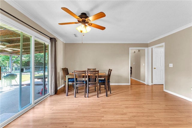802 Buford St, Springdale, AR 72762 - dining room with ceiling fan, light wood-style flooring, baseboards, and crown molding