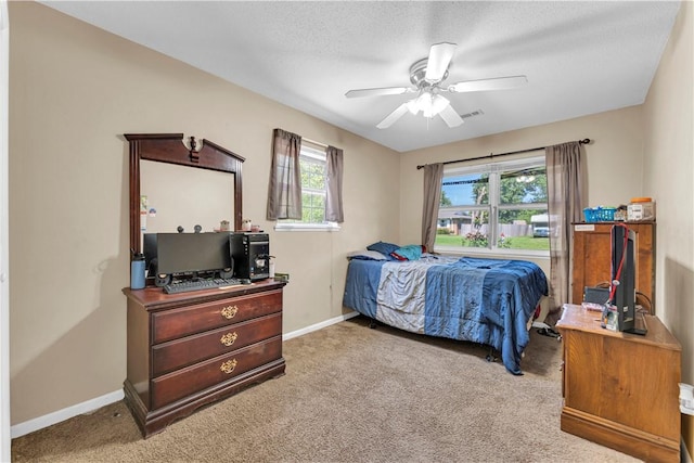 802 Buford St, Springdale, AR 72762 - bedroom featuring carpet floors, baseboards, ceiling fan, and a textured ceiling