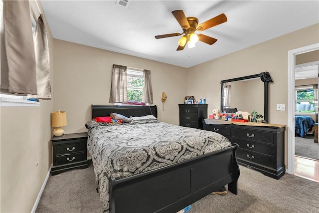 802 Buford St, Springdale, AR 72762 - carpeted bedroom with baseboards and a ceiling fan