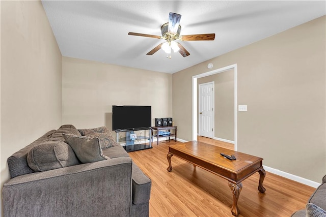 802 Buford St, Springdale, AR 72762 - living area with light wood-style flooring, a ceiling fan, and baseboards
