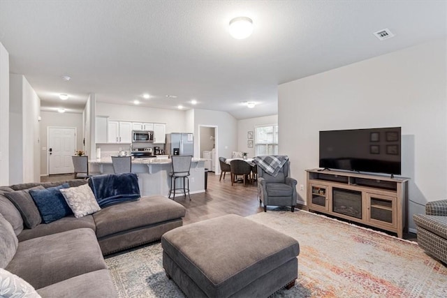 2213 E Fennec St, Siloam Springs, AR 72761 - living area featuring light wood-type flooring and baseboards