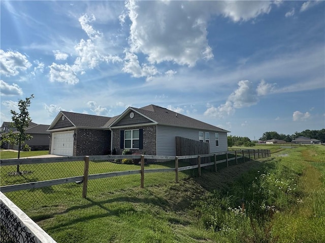 2213 E Fennec St, Siloam Springs, AR 72761 - single story home featuring driveway, a garage, and brick siding