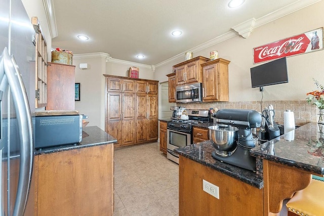 5703 S 66th St, Cave Springs, AR 72718 - kitchen with appliances with stainless steel finishes, brown cabinetry, a peninsula, crown molding, and dark stone countertops