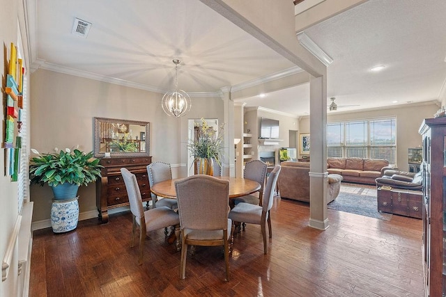 5703 S 66th St, Cave Springs, AR 72718 - dining area featuring decorative columns, wood-type flooring, ornamental molding, a chandelier, and ceiling fan