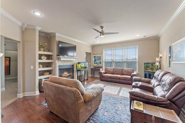 5703 S 66th St, Cave Springs, AR 72718 - living room featuring a fireplace, a ceiling fan, ornamental molding, dark wood finished floors, and recessed lighting