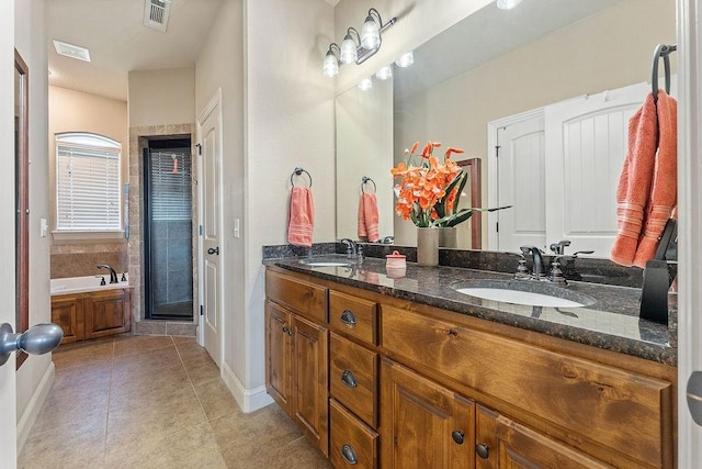 5703 S 66th St, Cave Springs, AR 72718 - full bath featuring double vanity, a stall shower, a garden tub, and tile patterned floors