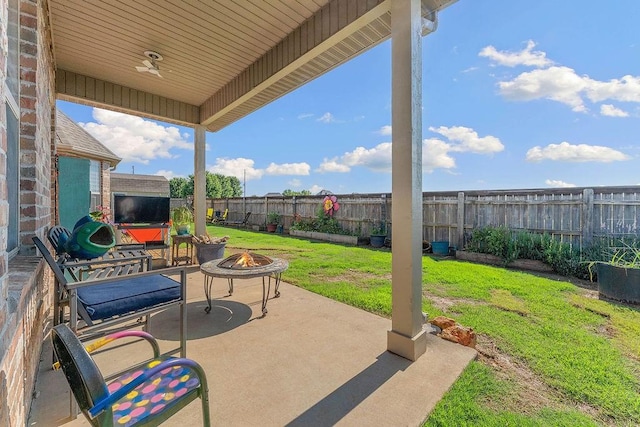 5703 S 66th St, Cave Springs, AR 72718 - fenced backyard featuring a fire pit and a patio