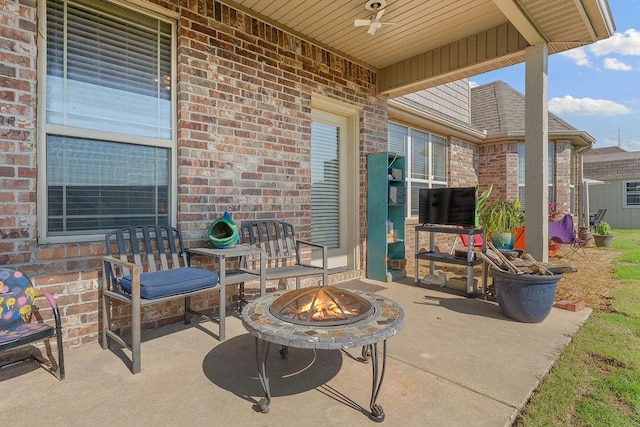 5703 S 66th St, Cave Springs, AR 72718 - view of patio / terrace featuring ceiling fan and a fire pit