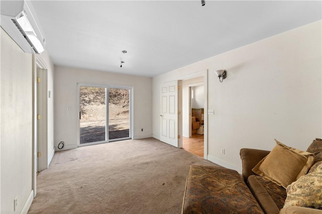 11021 Lathams Landing Rd, Garfield, AR 72732 - living room featuring light colored carpet, a wall unit AC, and baseboards