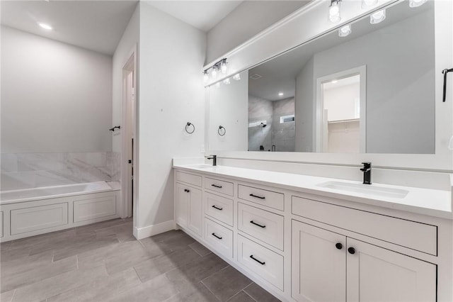 6741 Garden Trail Ave, Springdale, AR 72762 - full bathroom featuring a stall shower, double vanity, a bath, and a spacious closet