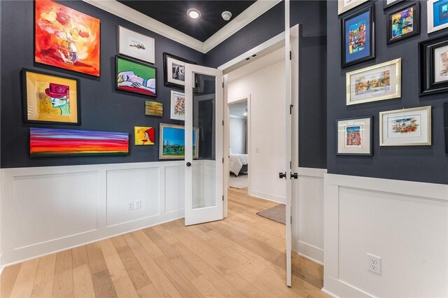 6741 Garden Trail Ave, Springdale, AR 72762 - hall featuring wood finished floors, a decorative wall, french doors, crown molding, and a wainscoted wall