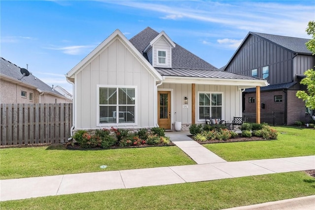 6741 Garden Trail Ave, Springdale, AR 72762 - modern inspired farmhouse with board and batten siding, a standing seam roof, a porch, and a metal roof