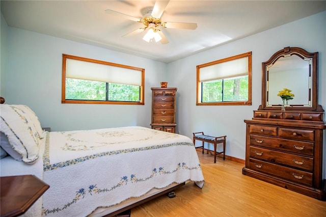 19 Bobwhite Ln, Holiday Island, AR 72631 - bedroom featuring light wood finished floors and a ceiling fan