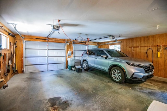 19 Bobwhite Ln, Holiday Island, AR 72631 - garage with wood walls and a garage door opener