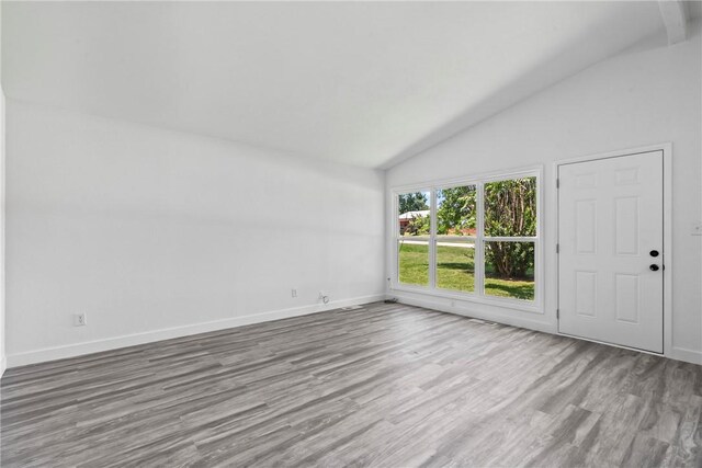 308 Kane St, Siloam Springs, AR 72761 - unfurnished room with lofted ceiling and wood finished floors