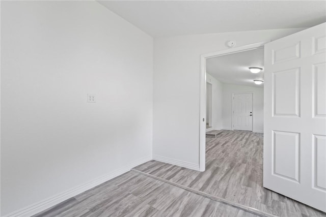 308 Kane St, Siloam Springs, AR 72761 - empty room featuring wood finished floors and baseboards