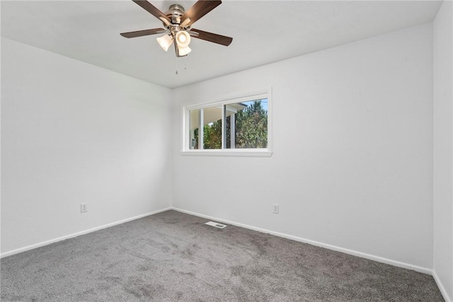 308 Kane St, Siloam Springs, AR 72761 - carpeted empty room featuring baseboards and a ceiling fan