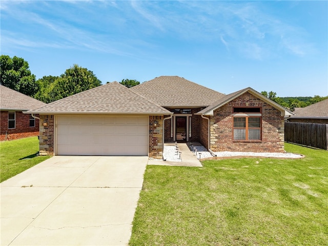1232 Big Oak Dr, Alma, AR 72921 - view of front facade with an attached garage, driveway, brick siding, and roof with shingles