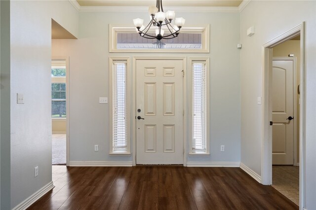 1232 Big Oak Dr, Alma, AR 72921 - foyer featuring dark wood finished floors, a chandelier, and crown molding