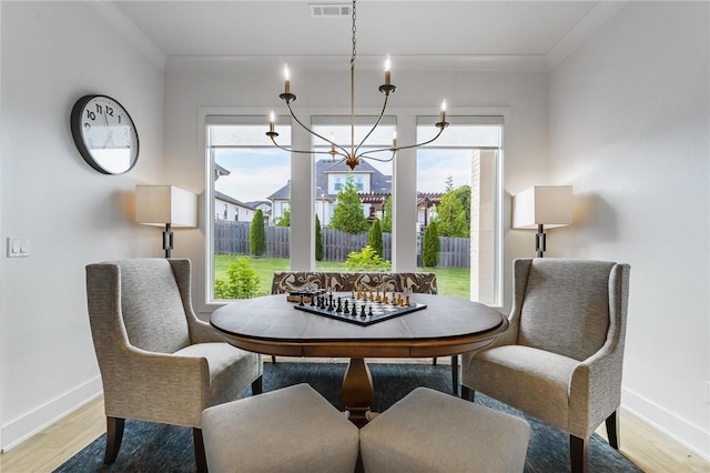 8003 W Claverton St, Rogers, AR 72758 - dining space featuring light wood-style flooring and a chandelier