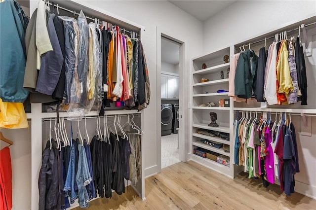 8003 W Claverton St, Rogers, AR 72758 - walk in closet with wood finished floors and independent washer and dryer