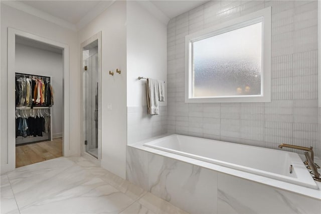 8003 W Claverton St, Rogers, AR 72758 - bathroom with a bath, a stall shower, and a spacious closet